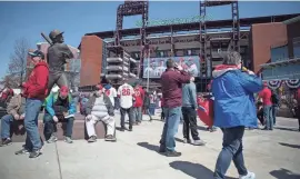  ?? JERRY HABRAKEN/THE NEWS JOURNAL ?? Fans enjoy pregame festivitie­s before the Phillies take on the Atlanta Braves on a previous Opening Day at Citizen Bank Park.