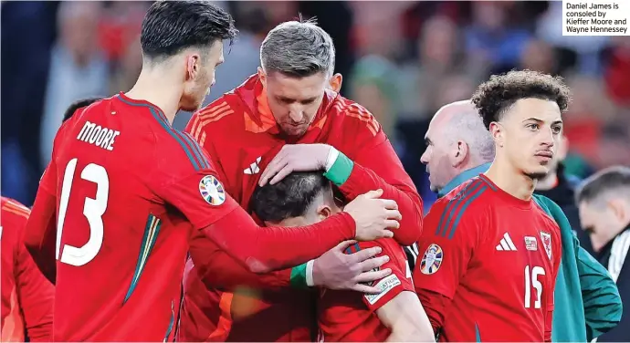  ?? ?? Daniel James is consoled by Kieffer Moore and Wayne Hennessey