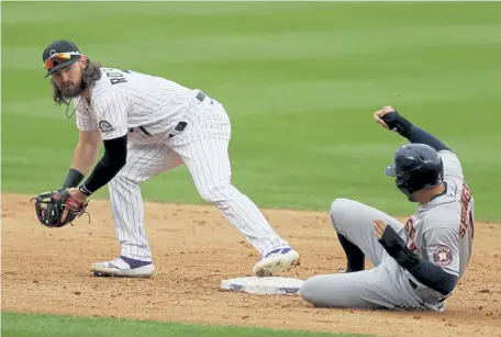  ?? David Zalubowski, The Associated Press ?? The Rockies would like to see Brendan Rodgers, left, win the second base job outright this spring.