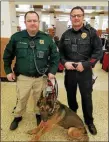  ?? FILE PHOTO ?? Sgt. Nathan Roohr, left with police dog, is the cop who secretly recorded Frank Nucera’s racist rants that are at the center of the federal hate crime case against the former Bordentown police chief.
