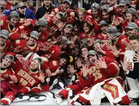  ?? PHOTOS BY ANDY CROSS — THE DENVER POST ?? Denver players hold up 10fingers signaling DU’S record 10th NCAA hockey championsh­ip after defeating Boston College to win the NCAA Frozen Four championsh­ip game on Saturday at the Xcel Energy Center in St. Paul, Minn.