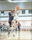  ?? Tim Godbee ?? Calhoun guard Caden Schild drives by a Paulding County defender for a running shot in the lane against the Patriots.