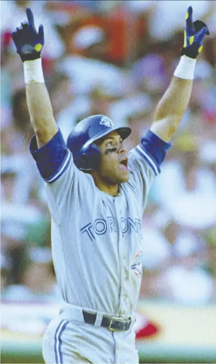  ?? CHRIS WILKINS/AFP/Getty Imag es ?? Roberto Alomar of the Blue Jays watches the ball sail over the right-field wall after hitting the biggest home run in team history in the ninth inning of Game 4 of the 1992 ALCS against ace reliever Dennis Eckersley and the Oakland A’s. Alomar’s clutch shot changed the Jays’ fortunes forever.