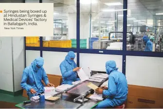  ?? New York Times ?? ■ Syringes being boxed up at Hindustan Syringes & Medical Devices’ factory in Ballabgarh, India.