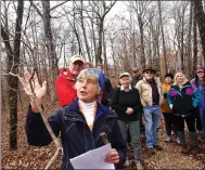  ?? NWA Democrat-Gazette/FLIP PUTTHOFF ?? Eleanor Jones checks limbs to identify a redbud tree along the Back 40 Trail System.