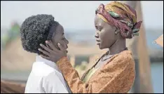  ?? EDWARD ECHWALU/DISNEY ?? Lupita Nyong’o (right) and Madina Nalwanga star in the triumphant true story “Queen of Katwe,” directed by Mira Nair.