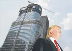  ?? Charles Rex Arbogast, Associated Press file ?? Donald Trump is profiled against his 92-story Trump Internatio­nal Hotel & Tower in Chicago during a May 24, 2007, news conference on constructi­on progress.