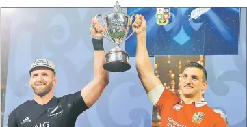  ??  ?? New Zealand skipper Kieran Read and his British and Irish Lions counterpar­t Sam Warburton with the trophy after the match. — Reuters photo