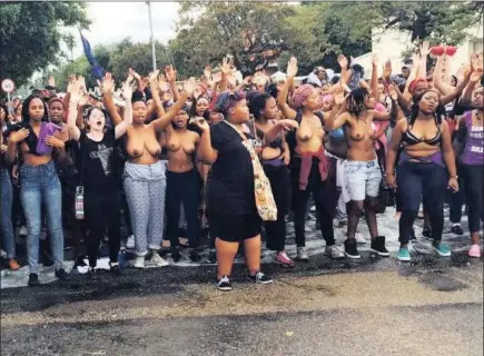  ??  ?? Rhodes University students protesting outside university premises after a list of alleged rapists on campus was shared on social media. Students protested topless to raise awareness of the rape culture at the university