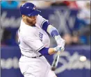  ?? Canadian Press photo ?? Toronto Blue Jays catcher Russell Martin (55) connects on a two-run home run off Chicago White Sox starter James Shields during sixth inning American League baseball action in Toronto.