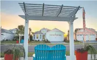  ??  ?? Exteriors of some of the model homes at the new Latitude Margaritav­ille Daytona Beach, Fla.