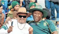  ??  ?? OUR BLOOD RUNS GREEN AND GOLD: Roger Joseph, left, and Sheldon Harmse drove in from Jeffreys Bay to watch the Springboks vs Argentina game at the Nelson Mandela Bay Stadium last Saturday