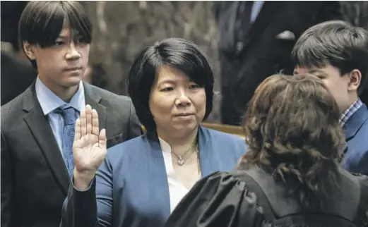  ?? ASHLEE REZIN/SUN-TIMES ?? Nicole Lee is sworn in Monday as 11th Ward alderperso­n, the first Asian American woman to serve on the Chicago City Council.