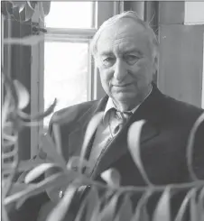  ?? CP PHOTO ?? Ernest Small, principal research scientist at the Ottawa Research and Developmen­t Centre with the Government of Canada, poses for a photograph beside an oleander plant at his office in Ottawa.