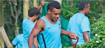  ?? Photo: FRU Media ?? Fiji Airways Fijian 7s playmaker Napolioni Bolaca helps in clearing the bushes at the Sigatoka Hospital on May 12, 2022.