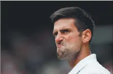  ?? AFP ?? Djokovic reacts after winning a point in Sunday’s final. The Serbian showed typical grit to battle back from a set down and triumph.