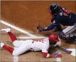  ?? MATT SLOCUM – THE ASSOCIATED PRESS ?? Phillies leadoff hitter Andrew McCutchen, showing sliding under a tag attempt by Atlanta Braves catcher Travis d’Arnaud during the season opener April 1, hasn’t been doing much traveling around the bases lately.