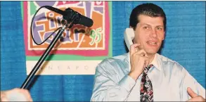  ?? Robert W Stowell Jr / Getty Images ?? UConn coach Geno Auriemma accepts a call from President Bill Clinton following his team’s victory in the national championsh­ip game in 1995.