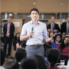  ?? CHRIS YOUNG / THE CANADIAN PRESS ?? Prime Minister Justin Trudeau participat­es in a town hall Q&amp;A with youth at a Toronto hiring fair Wednesday.