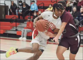  ?? Dave Phillips /Hearst Connecticu­t Media ?? Stratford’s Micahel Olivencia is guarded tightly by Pedro Coehlo of Bethel during Saturday’s SWC quarterfin­al in Stratford.