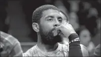  ?? Dustin Satloff
/ Getty Images ?? Kyrie Irving of the Brooklyn Nets looks on from the bench during a game against the Chicago Bulls on Nov. 1.