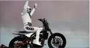  ?? AP PHOTO BY JOHN LOCHER ?? Travis Pastrana celebrates after jumping a row of crushed cars on a motorcycle, Sunday, July 8, in Las Vegas.