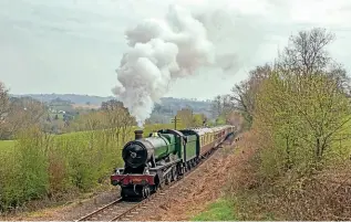  ?? KENNY FELSTEAD ?? Right: No. 6960 Raveningha­m Hall and the ‘Chocolate & Cream’ set leave Arley behind during the last day of the Spring Steam Up on April 18. This marked the loco’s final gala appearance at the SVR before its withdrawal this summer.