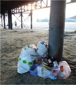  ??  ?? Bags of waste were left under the pier at Weston-super-Mare. Top, rubbish piled up around the seafront bins