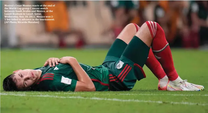  ?? ?? Mexico's Cesar Montes reacts at the end of the World Cup group C soccer match between Saudi Arabia and Mexico, at the Lusail Stadium in Lusail, Qatar, Wednesday, Nov. 30, 2022. Mexico won 21 but failed to advance in the tournament. (AP Photo/Ricardo Mazalan)