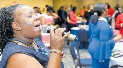  ?? RUDOLPH BROWN ?? Sister Nicky sings at the Jamaica Constabula­ry Force New Year’s Prayer Breakfast at The Jamaica Pegasus hotel on Wednesday.