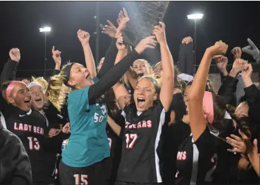  ?? AUSTIN HERTZOG - MEDIANEWS GROUP ?? Seniors Madison Gallagher (15) and Morgan Kline (17) lead the celebratio­n while raising the PAC championsh­ip plaque upon winning the PAC girls soccer title Thursday.