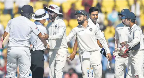  ??  ?? India captain Virat Kohli and R Ashwin celebrate with teammates after India handed Sri Lanka their heaviest Test defeat on Day Four at the VCA Stadium in Nagpur on Monday.
