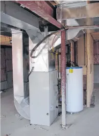  ?? STEVE MAXWELL PHOTO ?? Upgrading an old furnace can lead to energy savings of hundreds of dollars a year. This forced air natural gas furnace is also connected to central air conditioni­ng.