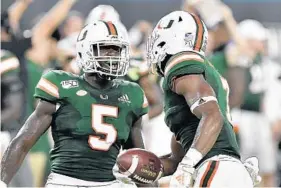  ?? MICHAEL LAUGHLIN/SUN SENTINEL ?? “Everyone should deserve the opportunit­y to benefit off their likeness,” Miami safety Amari Carter (5) said in response to the new law allowing college players to benefit off their likeness.