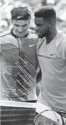  ?? LYNNE SLADKY/AP ?? “I think he's going to be really good. He's got big shots, and I like his mindset. That goes a long way,” Roger Federer, left, said of Frances Tiafoe during the Miami Open on Saturday in Key Biscayne, Fla.