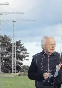  ?? PHOTO: PETER DOWDEN ?? Dick Dowden, Low Frequency Electromat­ic Research Ltd director, checks for local radio interferen­ce at the Unwin scientific radar facility at Awarua, near Bluff in 2009.