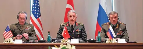  ??  ?? ANTALYA: This handout photo shows Chief of the General Staff of the Turkish Armed Forces Hulusi Akar (center), US Chairman of the Joint Staff General Joseph Dunford (left) and Russian Chief of General Staff General Valery Gerasimov during a meeting. —...