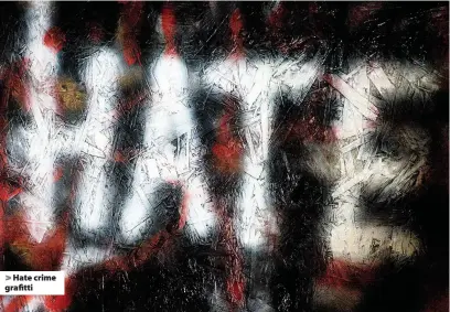  ??  ?? > Hate crime grafitti