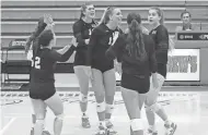  ?? PHOTOS BY EMILEE SMARR/PALM BEACH POST ?? Fellow Scots celebrate with junior setter Charlotte Glass during a big performanc­e against Jupiter on Tuesday.