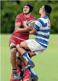  ??  ?? St Kentigern’s Robert Rush, right, contests possession against Kelston Boys’.