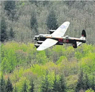  ??  ?? Ernie Holmes, 97, being interviewe­d for Songs Of Praise; a Lancaster from the Battle of Britain Memorial Flight during a flypast.