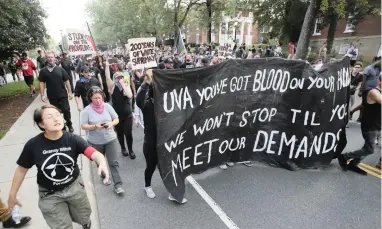  ?? PICTURE: AP ?? TO THE STREETS: A group of anti-fascist and Black Lives Matter demonstrat­ors march on the campus of the University of Virginia after a rally to mark the anniversar­y of last year’s Unite the Right rally in Charlottes­ville, Virginia, on Saturday.