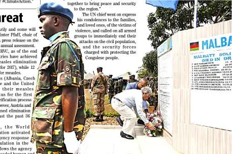  ??  ?? THE UN Secretary-General lays a wreath for fallen peacekeepe­rs in Mavivi town in the eastern Democratic Republic of the Congo.