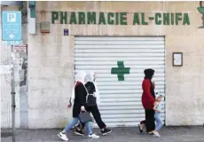  ?? — AFP ?? A shuttered door of a pharmacy in the Lebanese capital Beirut.