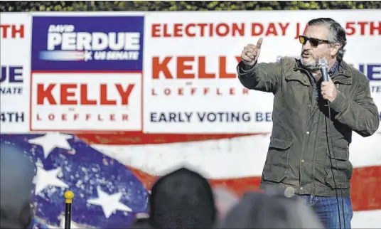  ?? Brynn Anderson The Associated Press ?? Sen. Ted Cruz, R-Texas, speaks Saturday at a campaign rally for Sen. Kelly Loeffler, R-Ga., in Cumming, Ga. Cruz announced a coalition of 11 senators and senators-elect who have pledged to reject the results of the Electoral College votes on Wednesday.