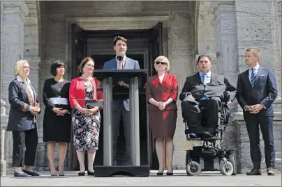  ?? CP PHOTO ?? Prime Minister Justin Trudeau talks to media with members of his newly shuffled cabinet, from left, Carolyn Bennett, minister of Crown-Indigenous relations and northern affairs, Health Minister Ginette Petitpas Taylor, Indigenous Services Minister Jane...