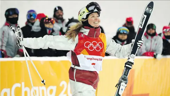  ?? JEAN LEVAC ?? Justine Dufour-Lapointe of Canada celebrates her silver medal in the women’s moguls at Phoenix Snow Park at the 2018 Winter Olympics in Pyeongchan­g, South Korea on Sunday.