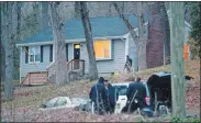  ?? TIM COOK/THE DAY ?? Police surround a house with a barricaded man inside Saturday on Stonybrook Road in Ledyard.