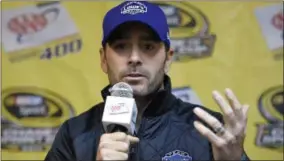  ?? NICK WASS — THE ASSOCIATED PRESS FILE PHOTO ?? Jimmie Johnson talks to reporters at an interview session for the NASCAR Sprint Cup series auto race at Dover last week.