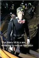  ??  ?? Thai Navy SEALS are working to rescue the boys